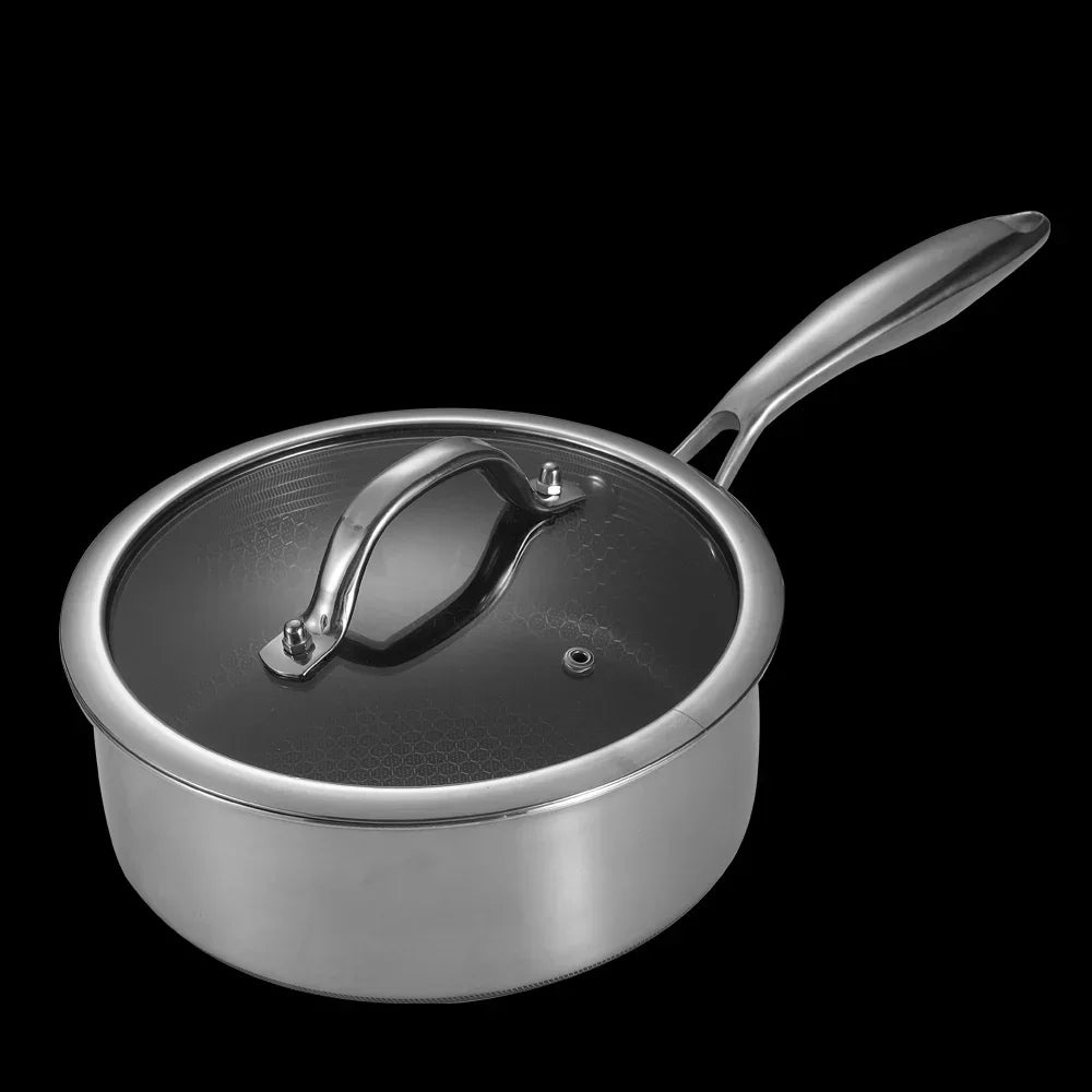Stainless steel saucepan with lid on a black background