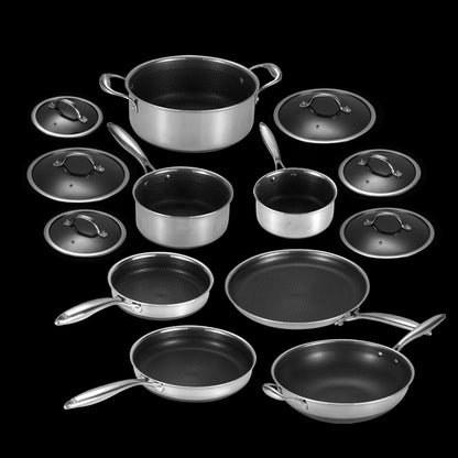 Set of cookware including pots, pans, and lids on a black background