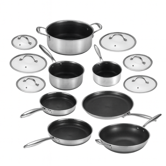 Set of cookware including pots, pans, and lids on a white background