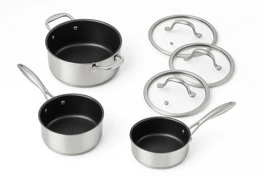 Set of stainless steel cookware with black interior and lids 