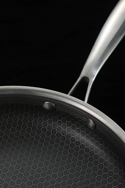 Close-up of a frying pan with a black background